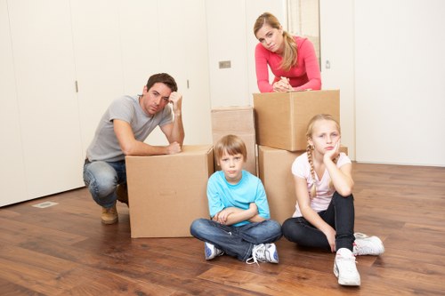 Removal team managing furniture during a Paddington flat move