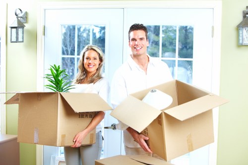 Organised storage unit in Paddington with labeled boxes and furniture