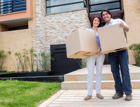 Removal team carrying furniture into a new Paddington home